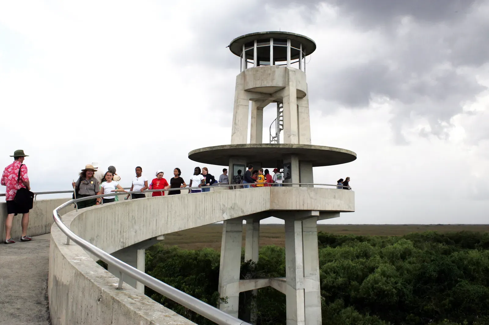 Visitors walking up the curved ramp of the Shark Valley observation tower