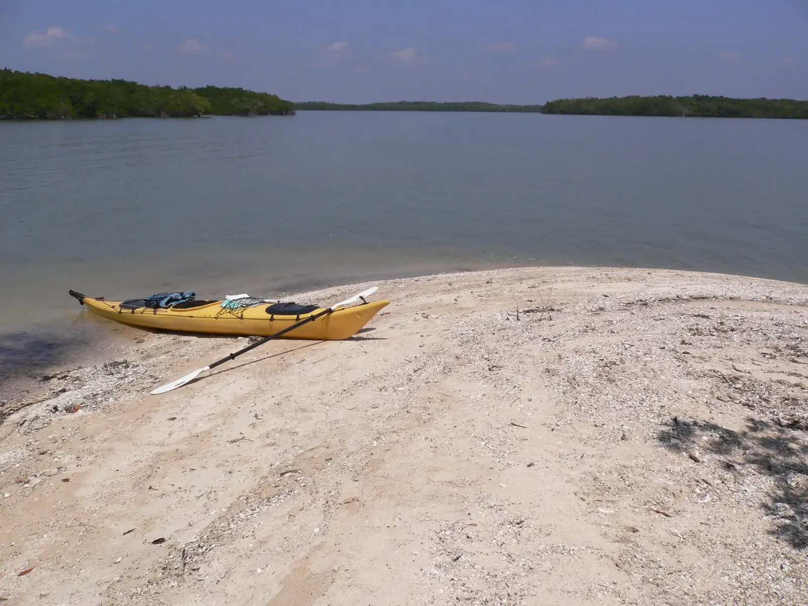 Kayak on a sandy beach facing mangrove islands in the Ten Thousand Islands